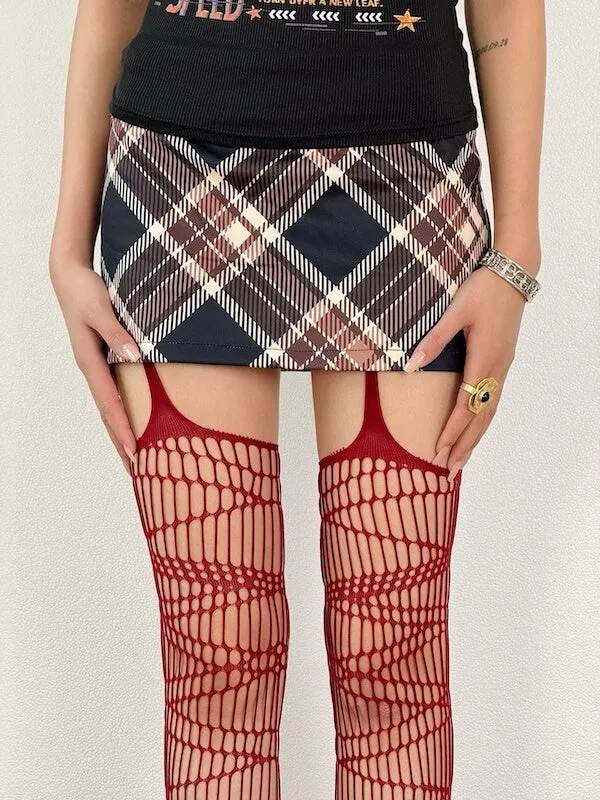 Dark punk strap ripped fishnet tights