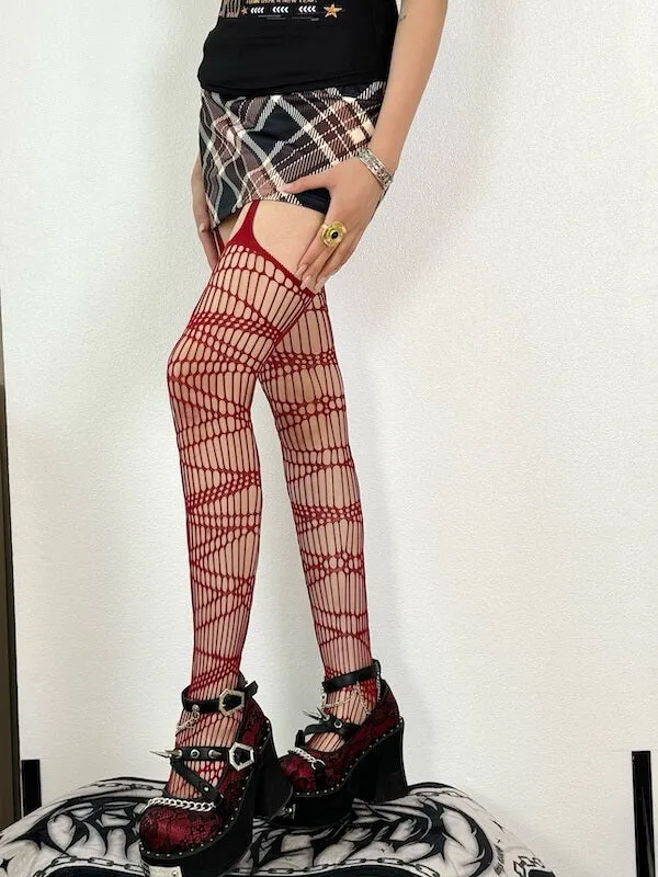 Dark punk strap ripped fishnet tights